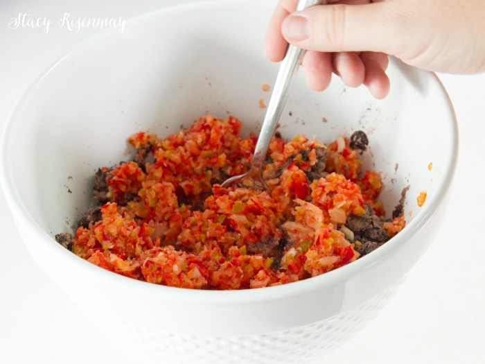 add-red-pepper-and-onion-to-smashed-black-beans