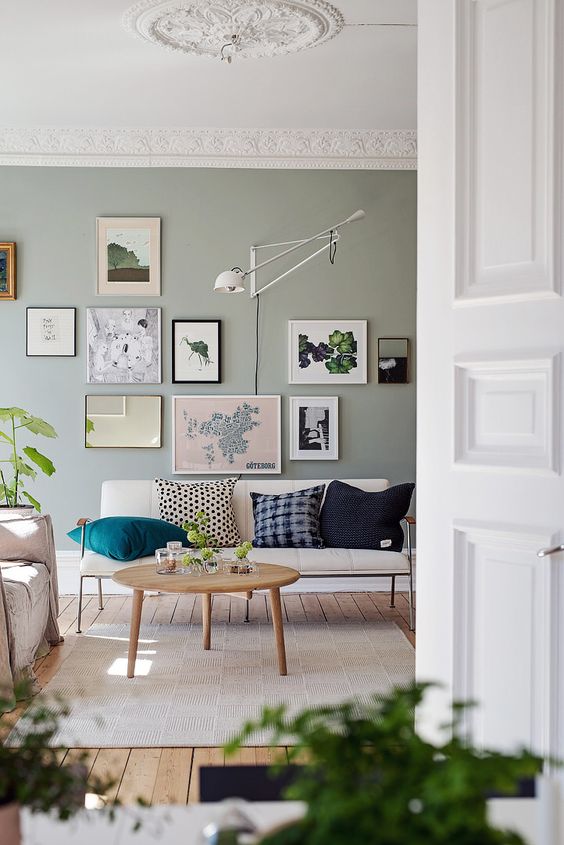 sage green walls with picture frames