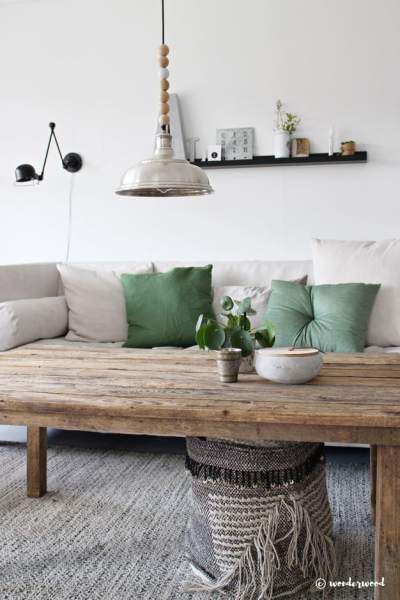 sage green pillows on a white couch