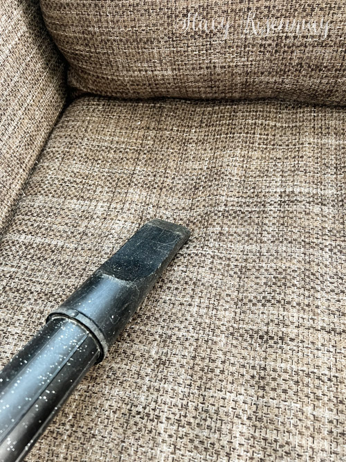 vacuuming couch before steaming