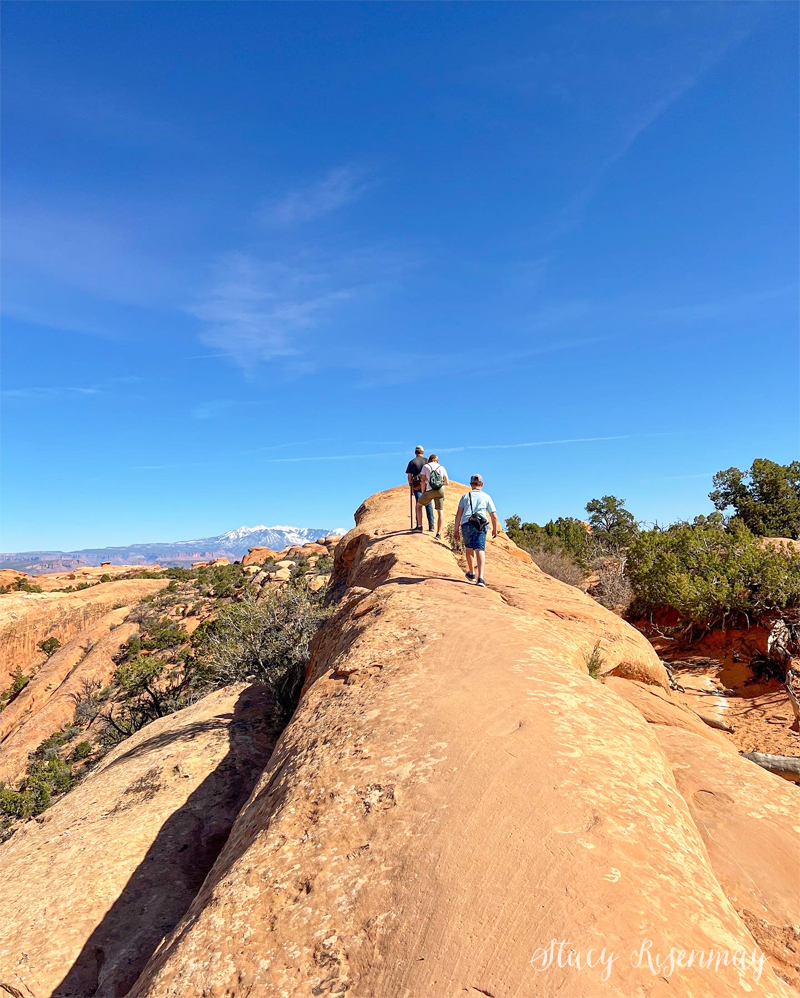 Walking along the ridge to get to Double O Arch at Arches National Park