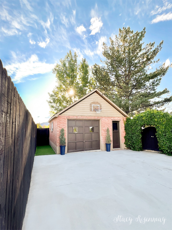 detached garage with dog run and driveway fence