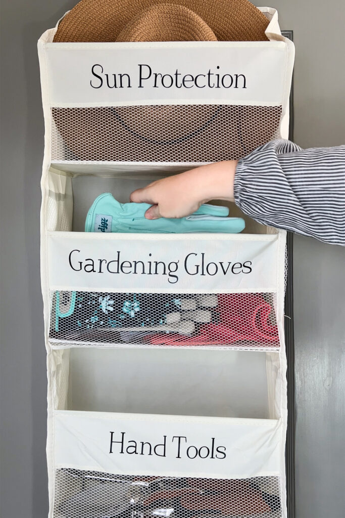 adding gardening gloves to an over the door organizer