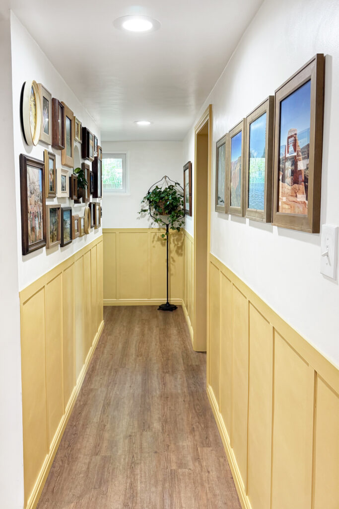 yellow hallway with gallery wall