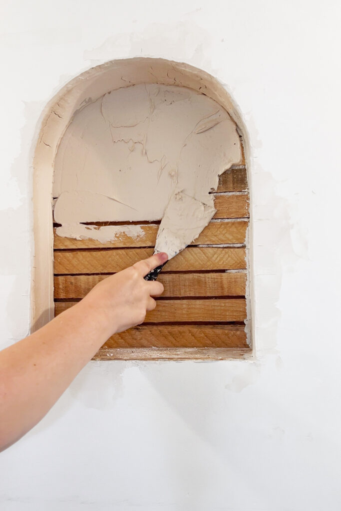 adding drywall mud to a recessed arched nook